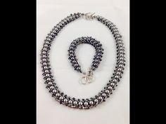 a black and silver beaded necklace with matching bracelet