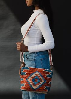 -Blue, rust & tan Aztec inspired crossbody bag -Removable strap -Measurements: 8" H x 12" W x 4" D -Content: 100% Cotton -Made in India Summer Crossbody Shoulder Strap For Daily Use, Multicolor Crossbody Shoulder Strap For Everyday Use, Summer Crossbody Bag Strap, Multicolor Crossbody Bag Strap, Multicolor Crossbody Bag Strap For Everyday Use, Multicolor Crossbody Shoulder Bag With Long Strap, Bohemian Orange Crossbody Shoulder Bag, Red Crossbody Bag Strap For Everyday Use, Red Crossbody Shoulder Strap For Daily Use