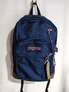 Carry all your essentials in this classic JanSport Cool Student backpack. PRODUCT FEATURES Dedicated 15" padded laptop compartment Two large main compartments Ergonomic S-curve shoulder straps Front utility pocket with organizer Fully padded back panel Side water bottle pocket Pleated front stash pocket Zippered front stash pocket Web haul handle PRODUCT DETAILS Zipper closure 17.5"H x 13"W x 10"D Polyester NOTE:  All items listed in our store are 100% authentic/original, they come from their ow Jansport Blue Backpack, Backpack With A Lot Of Pockets, Navy Jansport Backpack Aesthetic, Navy Jansport Backpack, Dark Blue Jansport Backpack, Jansport Navy Blue Backpack, Navy Blue Jansport Backpacks, Jan Sport Backpacks Aesthetic, Blue Jansport Backpacks