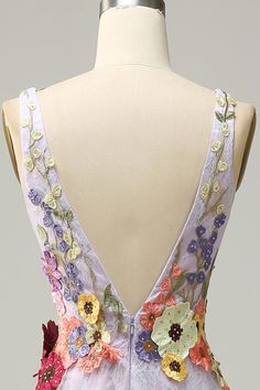 the back of a dress with flowers on it