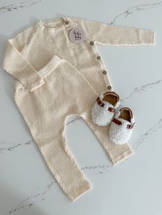 Get ready for cuteness overload with our baby sweater and pants set! Featuring a textured pattern, this long sleeve sweater has buttons on the side for easy dressing. The matching pants have an elastic waistband for a comfortable fit. Perfect for your little one's playful adventures! Cozy Playtime Sets For Fall, Soft Knit Long Sleeve Sweater For Playtime, Cozy Long Sleeve Sweater For Playtime, Cream Long Sleeve Sets For Fall, Beige Long Sleeve Sets With Buttons, Baby Sweater, Our Baby, Easy Dressing, Matching Pants