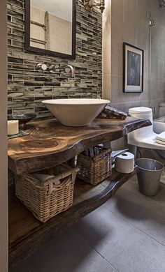 a bathroom with a sink, toilet and tub in it's centerpieces