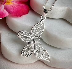 This a lovely necklace in 925 sterling silver with a cute Butterly as pendant hand crafted by us. Ideal as gift or for your fashion.  The chain is about 16" with an extended 2 more inches in case you need 18" as size.  The pendant is about 30x38 mm.  925 hallmark tag. It comes in a gift package. We aim to dispatch our orders in 24 hours using free 48 hours delivery but if you need your item quicker there is an option on the checkout for next day delivery for only £ 3.50. Elegant Silver Butterfly Necklace In Sterling Silver, Elegant Silver Butterfly Necklace Gift For Her, Delicate Sterling Silver Butterfly Necklace, Delicate Silver Sterling Silver Butterfly Necklace, Delicate Sterling Silver Butterfly Necklace In White Gold, Delicate White Gold Butterfly Necklace In Sterling Silver, Delicate White Gold Sterling Silver Butterfly Necklace, White Gold Necklace With Butterfly Charm, White Gold Necklace With Butterfly Charm In Sterling Silver