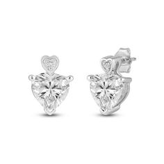 Delight in the elegance of these Fine Silver Heart Stud Earrings. Featuring a heart-shaped cubic zirconia centerpiece surrounded by round-cut stones, they exude charm and sparkle. The fine silver plating adds a luxurious touch, perfect for any occasion. Designed for women who appreciate timeless beauty, these earrings make an ideal gift for her. Whether for daily wear or special events, they enhance any outfit with their exquisite craftsmanship and enduring elegance. Size:  s .  Gender: female. Cross Earrings Studs, Mini Earrings, Silver Jewelry Earrings, Heart Stud Earrings, Cubic Zirconia Earrings, Round Stud Earrings, Zirconia Earrings, Big Earrings, Square Earrings