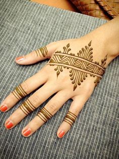 hendi tattoos on the palm of a woman's hand