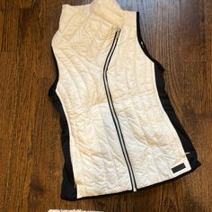 Nylon And Down Vest. Never Worn. 23” From Shoulder To Waist. 17” Chest, But Stretches To About 19”. White Nylon Outerwear For Sports, White Sporty Nylon Outerwear, White Nylon Sports Outerwear, Sporty White Nylon Outerwear, White Nylon Athleisure Outerwear, White Athleisure Nylon Outerwear, Functional White Nylon Outerwear, Fitted Casual Nylon Vest, Casual Fitted Nylon Vest