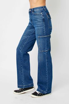 Expertly designed and crafted with a high waist and wide leg, the Judy Blue High Waist Wide Leg Cargo Jeans provide a stylish and comfortable fit. These jeans are made with high-quality materials for durability and feature practical cargo pockets for added functionality. Elevate your denim collection with these versatile and trendy jeans. Details:- High Waist- Wide Leg- Cargo Style with 6 Pockets Total- Lightly Stretchy Fabric Content:- 94% Cotton, 5% Polyester, 1% Spandex Blue Jean Romper, Paint Couture, Childrens Clothes Boys, Jean Romper, Candle Pedestal, Comfy Jeans, Judy Blue Jeans, Pant Length, Cargo Jeans