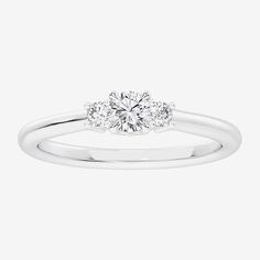 Ring Style: 3-Stone Rings, Side Stone Rings, Promise RingsDiamond Clarity: Si1-Si2Setting: Multi-SettingStone Cut: RoundStone Millimeter Measurement: 3.7 Mm Length, 3.7 Mm WidthDiamond Color: G-HMetal Color: WhiteCenter Stone Weight: 1/5 Ct.Ring Gallery Height: 5mmRing Top Width: 3.7mmRounded Carat Weight: 1/3 Ct. T.w.Band Width: 2mmCare: Wipe CleanStone Type: 7 Lab Grown DiamondAuthenticity: Lab Grown DiamondMetal: Sterling SilverCountry of Origin: Imported Timeless White Rings With Vs Clarity, Classic Three Stone Stackable Promise Rings, Classic White Birthstone Ring With Round Band, Classic White Gold Three Stone Birthstone Ring, Classic Three-stone Stackable Promise Rings, White Diamond Ring With Vs Clarity And Round Stone, Classic White Cluster Ring For Promise, White Classic Cluster Promise Ring, Timeless White Rings For Promise