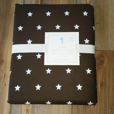 a brown and white blanket with stars on it