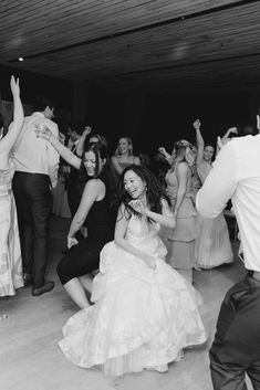 the bride and groom are dancing on the dance floor