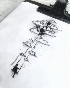 a drawing is being drawn on top of a piece of paper that has been inked