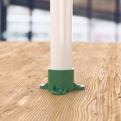 a blue and white pole on top of a wooden table