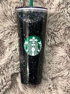 24oz  Custom Starbucks Glitter Snowglobe Tumbler   Cup Details: Includes one custom glitter tumbler, a lid and a green straw. Name color will be in permanent, high quality vinyl and will complement the glitter color unless otherwise specified. All tumblers will be sealed on bottom with my logo and handling instructions. How to order: Choose your size, lid and name option from drop down menu Care Instructions: -Hand wash only -Not Dishwasher Safe -Do Not Soak -Do not microwave -Avoid extreme heat -Do not Freeze -Cold Liquids Only Please feel free to message me with any questions, color options, etc. Please make sure to spell any personalizations correctly. Because tumblers are custom, all sales are final.  Glitter will settle to bottom and top of tumbler. (Just shake to activate "Snow Globe Holographic Black, Snowglobe Tumbler, Custom Glitter, Snow Globe, Tumbler Cups, Snow Globes, Tumbler, Glitter, Paper Party Supplies