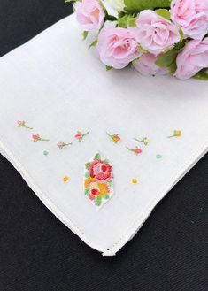 A delightful needlepoint appliqué of pink and red roses on a linen hanky with tiny yellow embroidered flowers.  Condition: Excellent vintage condition.  Size: 9 1/2 inches square Materials : Cotton  Age : 1950's to 1960's Colors: Pink, Red, Yellow, Green and White  Motif : Embroidered Floral Wedding Hanky Fabric note : Most of my hankies are nearly 70 years old and the fabric is quite delicate. Use with care.  Some repurposed vintage hanky ideas : baby bonnets, doillies, change purses, collars & Flower-shaped Embroidered Handkerchiefs For Gifts, Flower Shaped Embroidered Handkerchiefs For Gift, Embroidered Flower Handkerchiefs For Gifts, Embroidered Flower Handkerchiefs As Gift, Pink And Red Roses, Wedding Hankies, Baby Bonnets, Repurposed Vintage, Doll Dresses