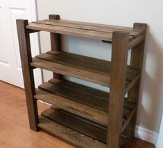 a wooden shelf sitting on top of a hard wood floor