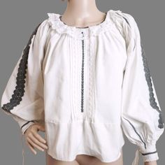 Romanian ethnic shirt, handmade folk blouse from Transylvania. Hand embroidered with black  cotton thread  on hand-woven fabric. Wide  puffy sleeves finished with cuffs. Lace collar around the neck. Age: 50-80 years or more  Condition: good, clean, prolonged, ready to wear. But the embroidery is discolored and there are a few difuse spots on one sleeve , very pale to be captured in photos . It looks like a very old shirt. Measure M-L: shirt length: 55 cm or 21.65 inches sleeve length measured from neck : 66 cm or 26 inches chest circumference: 120 cm or 47.24 inches' Good arm hole size . ( code 3 ) We accept returns and  the buyer pays for return shipping for old, vintage or antique products that we sell in our store. Traditional Long Sleeve Blouse With Woven Motifs, Peasant Style Cotton Blouse With Yoke, Peasant Style Cotton Blouse With Yoke Detail, Spring Folk Blouse With Woven Motifs, White Boho Collar Peasant Top, White Peasant Top With Boho Collar, Traditional Embroidered Tunic Peasant Top, Folk Style Cotton Blouse With Woven Motifs, Folk Style Cotton Blouse With Intricate Embroidery