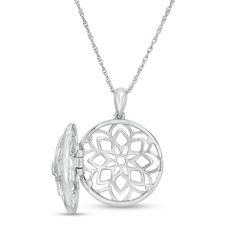 Make a clever statement of fashion with this enchanting diamond locket. Crafted in sterling silver, this mesmerizing style showcases an open-worked floral design of layered petal shapes centered with a sparkling bezel-set diamond. Dainty diamonds adorn the border for added shimmer. The final touch: the hinged choice opens to reveal space for two small photos or other mementos. Radiant with 1/8 ct. t.w. of diamonds and a bright polished shine, this locket suspends along an 18.0-inch rope chain th Elegant Flower Pendant Locket Necklace, Sterling Silver Locket Necklace With Flower Pendant, Sterling Silver Flower Pendant Locket Necklace, Elegant Silver Locket Necklace, Elegant Silver Flower Pendant Locket Necklace, Elegant Medallion Locket Necklace With Intricate Design, Fine Jewelry White Gold Locket, Elegant Round Sterling Silver Locket Necklace, Silver Medallion Locket Necklace With Detachable Pendant