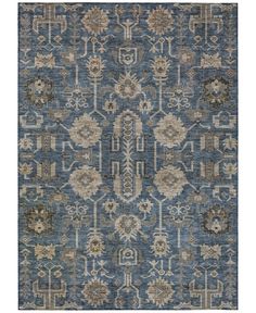 a blue rug with an ornate design on the front and back side, in various colors