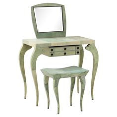 an antique vanity with mirror and stool