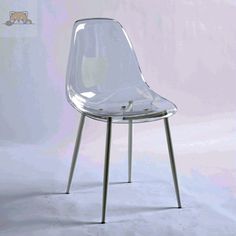 a clear plastic chair sitting on top of a metal frame stand in front of a white wall