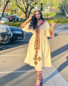 This fashionable Fetil Habesha dress is the perfect combination of traditional and modern style. The Shimena cut flatters your curves and adds a touch of elegance to the design, while the intricate Fetil embroidery on the neckline and sleeves is a true work of art, showcasing the skill and craftsmanship of Ethiopian artisans. The dress is made from high-quality fabric that feels soft and comfortable against the skin, while the modern design gives it a fresh, contemporary feel. The vibrant colors Habesha Dress Modern, Eritrean Dress, Habesha Dress, Habesha Kemis, Dress Modern, Cultural Events, Modern Dress, Modern Style, The Modern