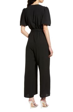 An updated alternative to classic officewear, this sleek jumpsuit features a flattering surplice neck and waist sash for an extra touch of elegance. 56" length Front button closure Surplice V-neck Short sleeves Removable tie belt Partially lined 100% polyester Hand wash, line dry Made in the USA of imported fabric Women's Clothing Chic Belted Jumpsuits And Rompers For Work, Chic Belted Jumpsuit For Workwear, Chic V-neck Business Casual Pantsuit, Chic Belted Jumpsuits And Rompers For Formal Occasions, Chic Belted Jumpsuits And Rompers For Formal Events, Chic Formal Belted Jumpsuits And Rompers, Sleek V-neck Jumpsuits And Rompers For Work, Chic Belted Jumpsuits And Rompers For Date Night, Chic Spring Pantsuit With Tie Waist