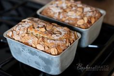 two pans filled with baked goods sitting on top of an oven burner next to each other