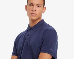 We love polos for many reasons. Chief among them: their unmatched versatility. You can dress them up or down, wear them under or with anything, and they'll always look on point. This Standard Polo Shirt is finished with a Levi's® graphic. The king of easy tops: the polo Streamlined detailing and silhouette for added versatility Crafted with supersoft fabric Finished with selvedge detailing on the neckline With Levi's® cursive script on the sleeve Navy Casual Polo Shirt Relaxed Fit, Casual Navy Relaxed Fit Polo Shirt, Navy Cotton Polo Shirt, Navy Cotton Polo Shirt For Spring, Navy Casual Short Sleeve Polo Shirt, Spring Navy Cotton Polo Shirt, Fitted Navy Casual Polo Shirt, Navy Casual Tops For Work, Casual Navy Tops For Work