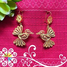 Beautiful and stunning handmade Mexican Filigree Earrings.  Each piece is meticulously created out of copper wire and spun into a beautiful design. To give it the final touch artisans dipped into gold plate for it's gold color.  This accessory is an important part of the traditional Tehuana outfit from Oaxaca, Mexico.  Look elegant while wearing Mexico's culture with this one of a kind earrings! Approximate length: 3.5 - 4 in Traditional Rose Gold Filigree Jewelry, Traditional Rose Gold Earrings For Gift, Gold Filigree Earrings As Gift, Gold Filigree Earrings For Gift, Gold Hoop Earrings With Pierced Copper, Elegant Copper Wire Drop Earrings, Artisan Copper Gold Hoop Earrings, Artisan Gold Hoop Earrings In Copper, Elegant Copper Filigree Jewelry