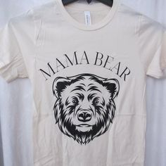 New Without Tags - Sweetees T-Shirt - Size Xs. Bella Canvas 100% Cotton. Crew Neck, Short Sleeve T-Shirt In A Cream Coloring With Black Mama Bear Print Front. Bear T Shirt, Bear Print, Mama Bear, Black Cream, Cream Color, Bella Canvas, Womens Tops, Tops & Tees, Crew Neck