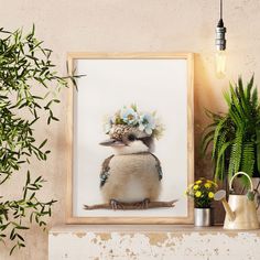 a bird with a flower crown on its head sitting in front of a potted plant