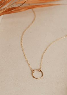 We love jewelry we can live in, like this Full Circle Necklace. Wear it alone or layered with your favorite delicate choker. Circle measures just over 1/2" wide. Offered in 16" or 18" lengths. Available in 14kt Gold Fill + Sterling Silver. Handmade in Eau Claire, WI. Our jewelry is handmade so each piece will be unique and may vary slightly from what is pictured. Everyday Simple 14k Gold Jewelry, Simple 14k Gold Necklace With Adjustable Chain, Simple Adjustable 14k Gold Jewelry, Dainty Recycled Gold Jewelry With Simple Design, Simple Adjustable Jewelry In 14k Gold, Simple 14k Gold Jewelry With Simple Design, 14k Gold Jewelry With Delicate Circle Chain, Simple Everyday Jewelry With Delicate Chain, Simple 14k Gold Necklaces