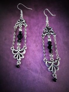 Introducing our exquisite pair of long and lightweight gothic Victorian style chandelier earrings with chain. Designed to make a statement, these earrings showcase a perfect blend of elegance and edginess. Crafted with care and attention to detail, these earrings feature intricate detailing that captures the essence of gothic and Victorian aesthetics. The elongated design gracefully dangles from your ears, creating a captivating effect that is sure to turn heads. Made from high-quality materials, these earrings are not only stunning but also comfortable to wear for extended periods. Take your style to new heights with these enchanting chandelier earrings, perfect for adding a touch of drama to any outfit. Each product is one of a kind so there might be slight variations in colour, thicknes Elegant Metal Chandelier Earrings With Chain, Elegant Chain Chandelier Earrings As Gift, Earrings With Chain, Gothic Vampire, Diy Jewelry Projects, Gothic Victorian, Statement Jewellery, Victorian Gothic, Chain Earrings