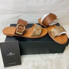 New Women Coach Hallie Signatire Sandals Kahki / Saddle Leather Size 5.5 Comes In Original Box Coach Sandals With Buckle Closure And Round Toe, Flat Sandals With Buckle Closure For Outings, Coach Beige Open Toe Sandals, Chic Leather Sandals With Leather Trim, Coach Sandals With Ankle Strap And Removable Insole, Coach Sandals With Ankle Strap And Buckle Closure, Leather Sandals With Leather Trim For Spring, Beach Leather Mules With Heel Strap, Leather Sandals With Round Toe And Leather Trim