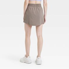 Why we're ALL IN: Woven mid-rise skort with built-in shorts in a regular-fit silhouette makes a cool choice for your active days. Moisture-wicking, quick-dry lightweight fabric helps you stay cool, while a drawcord elastic waistband provides a snug fit. Side pocket provides hands-free convenience and the UPF 50+ rating offers sun protection. All in Motion™: Made for every move, priced for every day. Casual Activewear With Built-in Shorts Above Knee, Casual Training Shorts With 5-inch Inseam, Casual 4-way Stretch Skort For Running, Casual Running Skort With 4-way Stretch, Casual Short Skort For Training, Casual Short Training Skort, Casual Skort With Built-in Shorts For Running, Casual Short Skort For Running, Casual Training Skort With Built-in Shorts