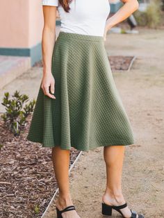 Hey there fashionista! Are you tired of wearing jeans all the time? Switch things up with our Quilted Laura Skirt in Gray. This skirt is not only stylish but also incredibly comfortable. You'll feel like you're wearing your favorite pair of sweatpants, but you'll look like a fashion icon. Pair this skirt with a simple tee, a jean jacket, and some sandals for the perfect spring outfit. It's versatile enough to wear to a casual lunch with friends or a night out on the town. Our sizing options make Perfect Spring Outfit, Maxi Skirt Dress, Fashion Icon, Knee Length Dresses, Be Honest, Knee Length Skirt, Romper Pants, Knee Length Dress, Spring Outfit