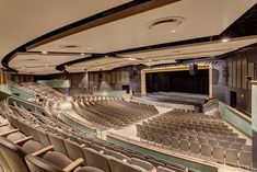 an empty auditorium filled with lots of seats