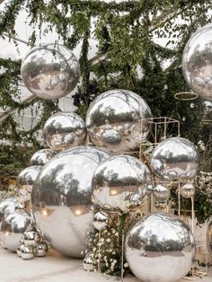 large silver balls are stacked on top of each other