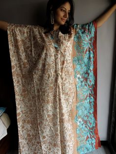 "I made this Kaftan from a beautiful Cream with Brown and blue 100% mulmul cotton. But I have the same fabric available in many other colors so during checkout just choose the color you want this robe in. The color swatches are shown in the last pic. If you want the same one as pictured, just select the \"Same as Picture\" option in the \"colors\" variation during checkout. Mulmul is a very fine variety of cotton which is extremely soft and it gets softer with every wash. It is so free flowing, White Festive Maxi Dress For Beach, Festive White Maxi Dress For The Beach, Festive White Maxi Dress For Beach, Festive Turquoise Bohemian Dress, Printed Beach Dresses For Festive Season, Festive White Beach Dress, Festive Long Kimono For The Beach, Festive Long Kimono For Beach, Cotton Beach Dresses For Festivals