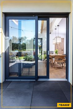 an open patio with sliding glass doors leading into the dining room