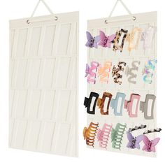 two white wall hangings with various pairs of hair clips on each one and the other