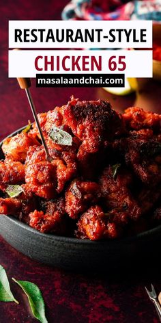 a bowl filled with meat and sauce on top of a table