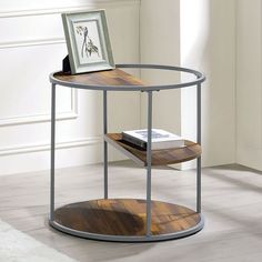 a round table with a wooden shelf on the side and a framed photograph on top