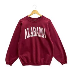 Code : p/576 Vintage 90s University Alabama Red Sweatshirt Medium Alabama Crewneck Alabama Crimson Tide Sweater Pullover Alabama Crimson Tide Print Logo Size on Tag :  M Details Measurement  Arm Pit to Arm Pit : 22.5"inches Back Collar to Hem : 27"inches Condition :  Great Vintage Condition(Used Clothing).No Holes And No Stain.Please refer pictures detail.‼️ Casual Burgundy Crew Neck Sweater, Red Collegiate Cotton Sweater, Red College Sweater With Ribbed Cuffs, Oversized Red Sweater With Letter Print, Vintage Fall Sweater With Letter Print, Red Oversized 90s Tops, Oversized 90s Red Top, Retro Red Top With Ribbed Cuffs, Red Letter Print Sweater For Fall