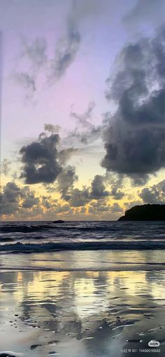 the sky is reflected in the wet sand