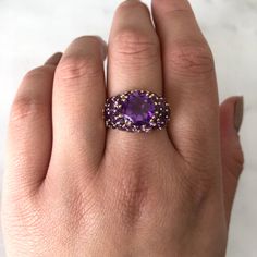 A statement ring is more than just an accessory; it's a reflection of your individuality and flair. Whether you're attending a special event, adding a touch of glamour to your everyday look, or simply treating yourself to something special, our statement rings are sure to make you stand out from the crowd.
.
.
.
#healingcrystals #gemstones #crystallove #amethyst #crystalhealing #crystalsofig #crystalmagick #chakras
#vintagestore #vintageshop #shopvintage #vintagefinds #vintagedesign #vintagelove Luxury Purple Amethyst Ring With Halo Setting, Fine Jewelry Purple Amethyst Multi-stone Ring, Purple Gemstone Cluster Ring For Formal Occasions, Purple Multi-stone Amethyst Ring Fine Jewelry, Purple Multi-stone Amethyst Ring In Fine Jewelry Style, Amethyst Ring With Gemstone Accents For Anniversary, Purple Multi-stone Amethyst Ring, Formal Purple Gemstone Cluster Ring, Luxury Lavender Amethyst Ring With Center Stone