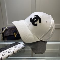 SHOP MORE LUXURY PRODUCTS HERE Description Chanel Cap White Chanel branded Cap with a dynamic and youthful design WhiteWhite FabricCC Logo Includes box, dust bag.This product is of the premium quality. Chanel Cap, Dior Shirt, Gucci Shirt, Louis Vuitton Shirt, Chanel Shirt, Branded Caps, Chanel Brand, Cap White, Chanel Logo