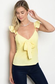 On Trend Yellow Lettuce Edge Ruffle Blouse Scooped Neck Ruffle Cap Sleeve with a Front Bow Detail 95% Polyester 5% Spandex - Lined Top Junior Sizes - Small, Medium, Large - Fits True to Size Wash in Cold Water Dry Low heat Made in the USA Black Ruffle Top, Dressy Shirts, Womens Tops Dressy, Dressy Blouse, Bow Blouse, Neck Ruffle, Junior Outfits, Yellow Fashion, Dressy Tops