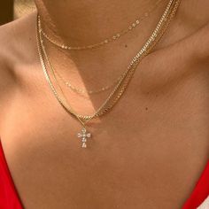 The Genevieve Necklace is a classic, dainty piece. Made with a cubic zirconia gem cross pendant that sparkles and catches the eye, this necklace is perfect for day to night wear. Designed with a non-tarnishing curb and twist chain, this light weight necklace looks luxury without the heavy weight. Delicate Chain Necklace With Cross Pendant, Cross Pendant Chain Necklace, Dainty Cross Jewelry In Cubic Zirconia, Dainty Cubic Zirconia Cross Jewelry, Dainty Cross-shaped Cubic Zirconia Jewelry, Cubic Zirconia Cross Necklace With Clavicle Chain, Dainty Cross Necklace In Cubic Zirconia, Dainty Cubic Zirconia Cross Necklace, Light Weight Necklace