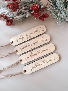 four wooden tags that say something you want